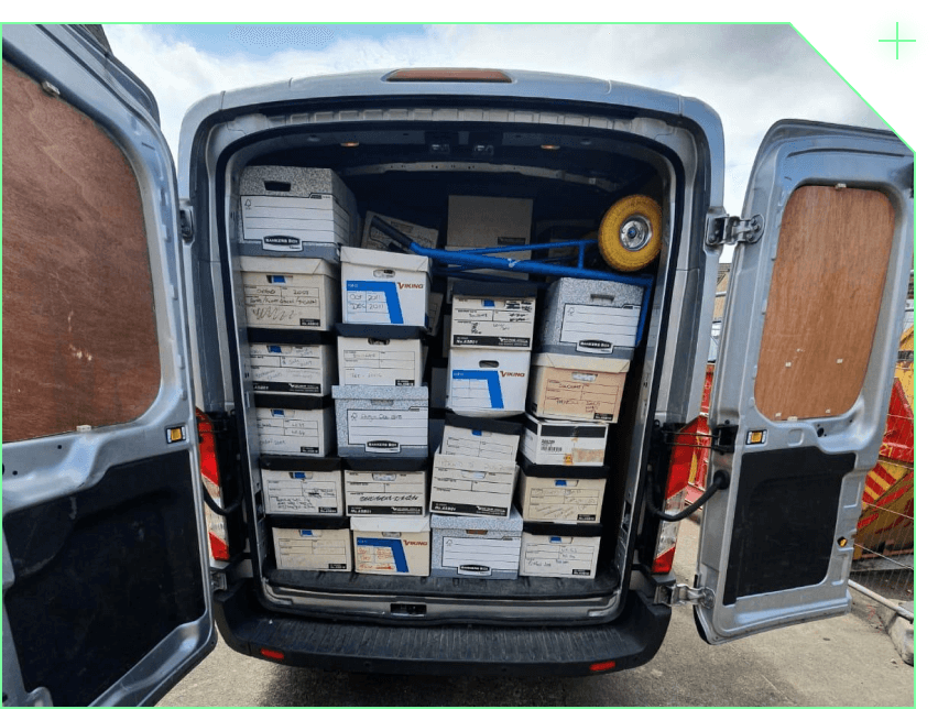 A GPS-tracked Identity Destruction collection van filled with securely stacked archive boxes.